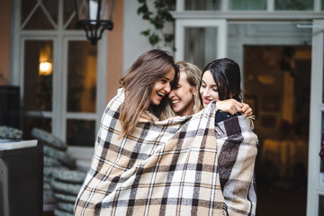 Three girlfriends on the veranda