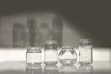 jars isolated white background glass shadow table gray glassware set empty four clear transparent black
