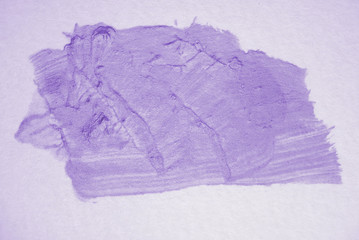 purple watercolor stain on white watercolor textured paper