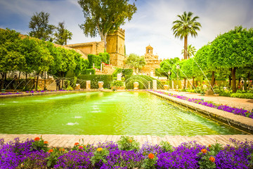 The famous Alcazar with beautiful garden in Cordoba, Spain, toned