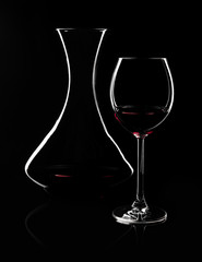 Contours of red wine glass and decanter