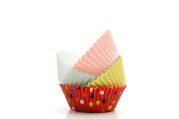 Stacked Multi-Colored Muffin Baking Cups on White Background
