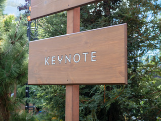 Keynote wooden sign post providing direction
