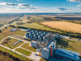 Large modern silos granary steel tanks or containers for silos, wheat and other cereals. Industrial...