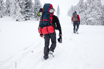 Fototapeta na wymiar trekking in snowy winter mountains