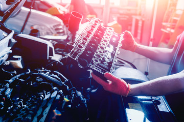 Repairing engine at service station. Car repair. Background