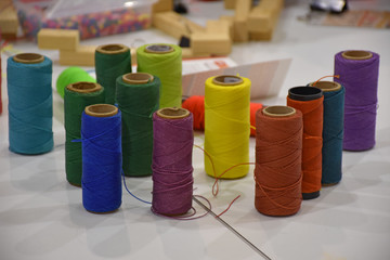 Close-up of balls of cotton of various colors.