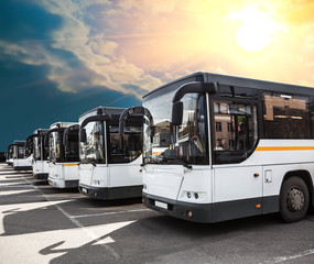 Fototapeta na wymiar city buses in the parking lot under the sunny sky