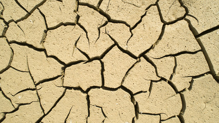 Aerial view of Dry cracked earth. Climate change and drought land. Global warming. 