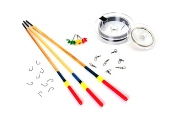 floats, hooks, fishing line and fishing accessories on a white background close-up