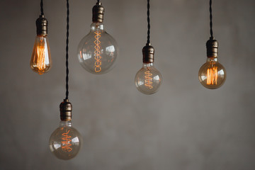 Set edison retro lamp on loft gray concrete background.