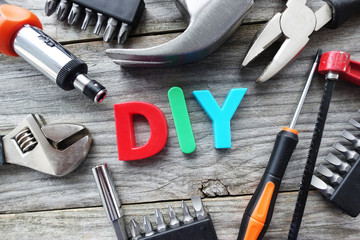 Construction tools and DIY letters suggesting do it yourself concept
