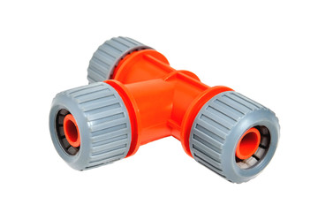 Triple adapter for watering hoses, white background close-up