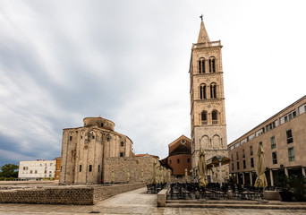Fototapeta na wymiar 9th century church of St Donatus on the left and the bell tower of the Zadar Cathedral on the right in Zadar, Croatia