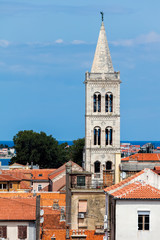 Fototapeta na wymiar Bell tower of the Zadar Cathedral of St. Anastasia in Zadar, Croatia. The tower construction started in 1452 and finished in 1893.