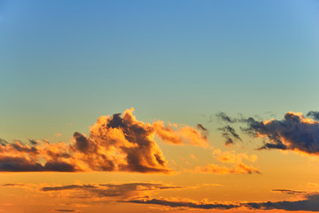 Clouds on the evening orenge and blue sky