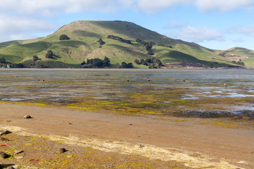 Stones on the shore, mountain behind