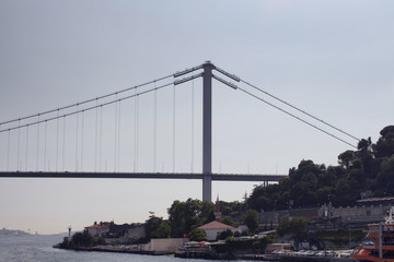 View of Bosphorus bridge with a clear blue sky in the background in Istanbul.