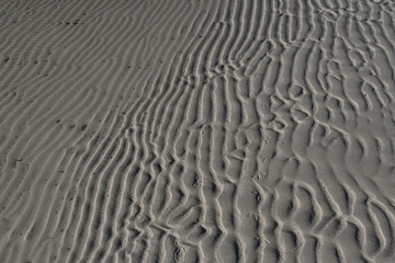 Detail of wave and ridges left in the sand on the beach at low tide on Isla Holbox Mexico