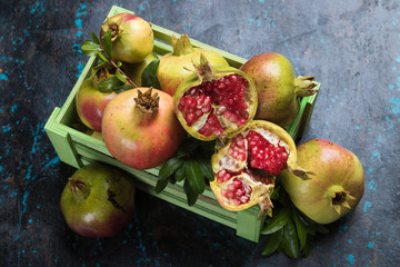 Ripe pomegranate fruit, opened with red seeds