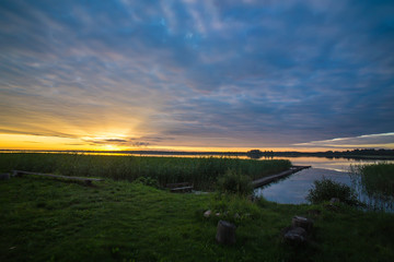 Naklejka premium summer landscape dawn on the shore of the lake