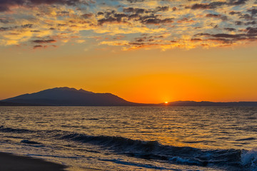 Fototapeta premium Early morning , dramatic sunrise over sea and mountain. Photographed in Asprovalta, Greece.