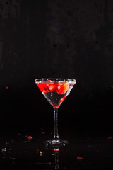 vodka strawberries in martini glass