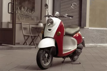 Fototapete Roller Vintage Roller steht in einer Gasse. Nachbearbeitung im Vintage-Stil  © Alex J