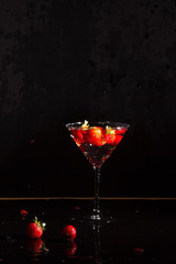 vodka strawberries in martini glass