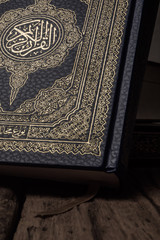 Koran - holy book of Muslims ( public item of all muslims ) on the table , still life