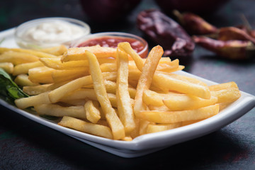 French fries with ketchup and mayonnaise