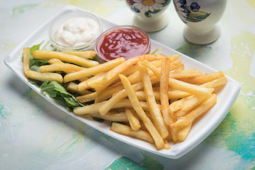 French fries with ketchup and mayonnaise