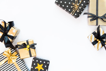 Top view of gift boxes in various black, white and golden designs. Flat lay, copy space. A concept...