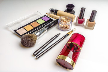 Set of decorative cosmetics, makeup tools and accessory on white background. Professional beauty,...