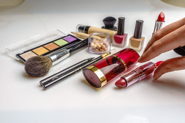 Set of decorative cosmetics, makeup tools and accessory on white background. Professional beauty,...