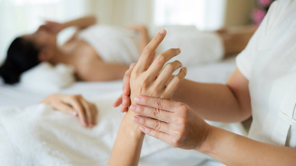 Obraz na płótnie Canvas hand massage body care and spa treatments at beauty spa salon