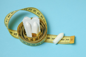 Suppository for anal or vaginal use and yellow measuring tape. Candles for the treatment of...