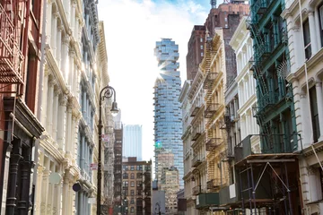 Foto op Plexiglas Sunlight shines on the buildings along Greene Street with a view towards the intersection on Canal Street in SOHO Manhattan, New York City © deberarr