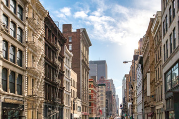 Sunlight shines on the buildings along Broadway in SoHo, New York City