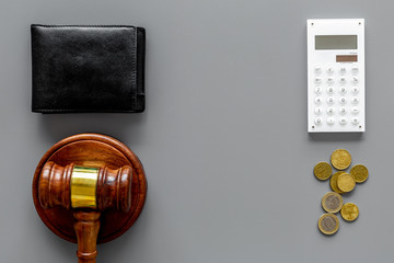 Financial failure, bankruptcy concept. Judge gavel, wallet, coins, calculator on grey background top view copy space