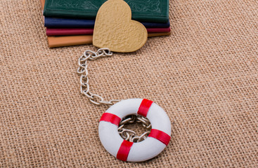 Books attached to a life saver with a chain