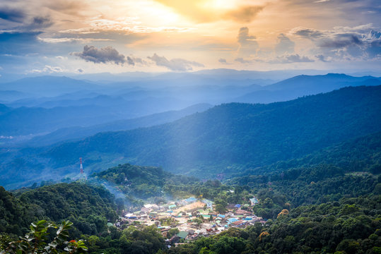 Top landscape View of mountain village on Doi Pui Mountains in sunset sky and clouds , Chiangmai , Thailand