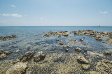 Clear Sea Water, Granite Rock, Cloudy Blue Sky and Tropical Beach
