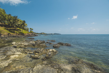 Fototapeta na wymiar Beautiful Tropical Beach with Granite Rocks and Blue Sky