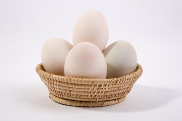 Eggs in the basket Isolated on White Background