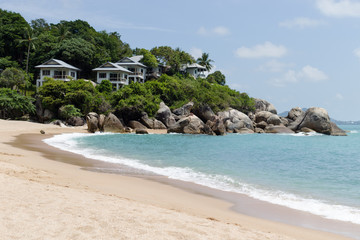 Beautiful tropical view of blue sky, sandy beach, and blue tropical sea in Koh Samui, Thailand