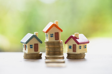 Mini house on stack of coins, Real estate investment, Save money with stack coin, Business growth...
