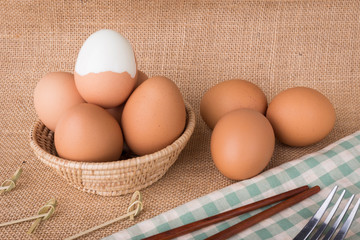 Set Eggs in a basket on  gunny (sackcloth)  background