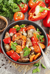 Chicken liver with sweet pepper and tomatoes
