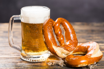Oktoberfest concept - beer mug with german pretzel